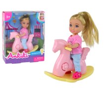 Baby doll for children on a rocking chair, pink rocking horse