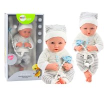 Baby doll in white and gray striped clothes, hat, pacifier, quilt